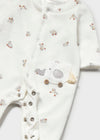 footie set with vintage toy print on cream fabric, featuring an elephant pocket detail and snap button closure.