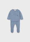 Blue baby knit two-piece set with a long-sleeve top and footed pants.