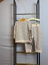Baby two-piece set with leopard spot print in neutral colors, featuring a long sleeve top and matching pants.