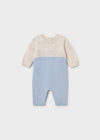 A blue and beige knit baby romper with long sleeves and a round neckline.