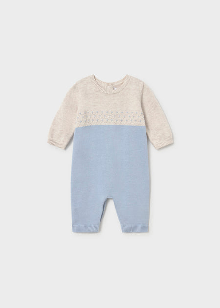 A blue and beige knit baby romper with long sleeves and a round neckline.