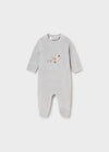 Grey baby footie with embroidered toy motif and snap button closure.