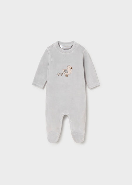 Grey baby footie with embroidered toy motif and snap button closure.