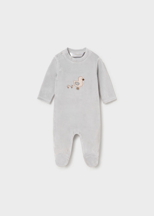 Grey baby footie with embroidered toy motif and snap button closure.