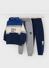 Three-piece kids' set with a blue hoodie featuring 'Stay Cool' text and two pairs of sweatpants in grey and navy.