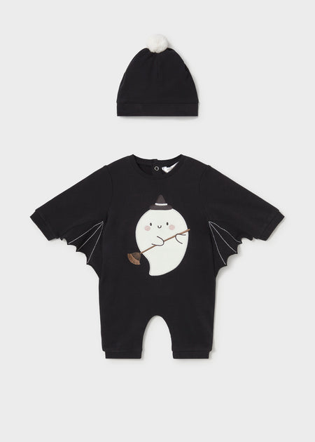 Black one-piece baby outfit with a ghost motif and bat wings, includes a matching hat with a pom-pom.
