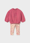 Pink sweatshirt with floral embroidery and multicolor floral leggings for children.