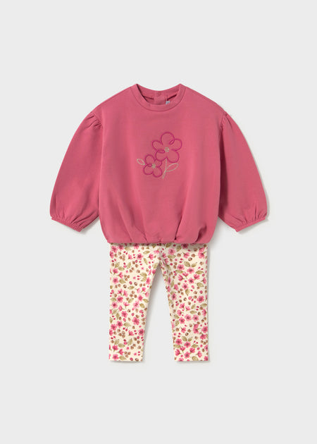 Pink sweatshirt with floral embroidery and multicolor floral leggings for children.