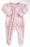 Light pink stripe ribbed footie with frill accents and front zipper, matching headband included.